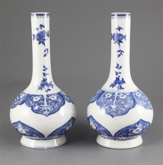 A pair of Chinese blue and white bottle vases, late 19th century, 28cm, one neck broken and glued